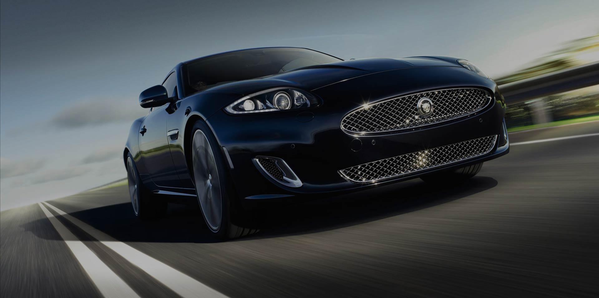 Black Sports Car On a Highway